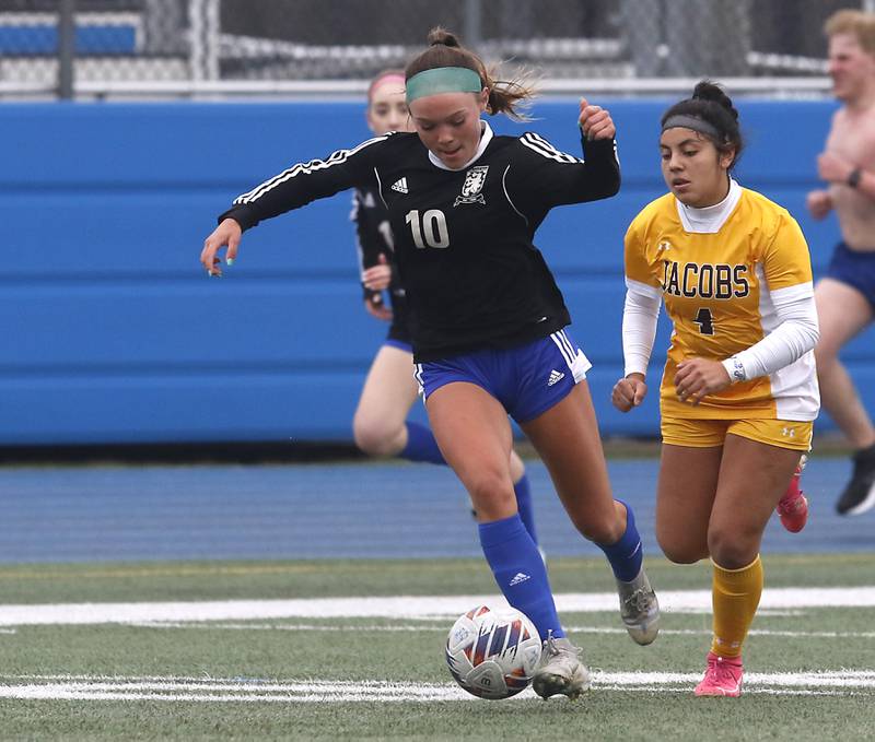Lake Zurich’s Sydney Arendarzyk controls the ball in front of Jacobs' Sam Diaz during a nonconference girls soccer match Tuesday, April 4, 2023, at Lake Zurich High School.