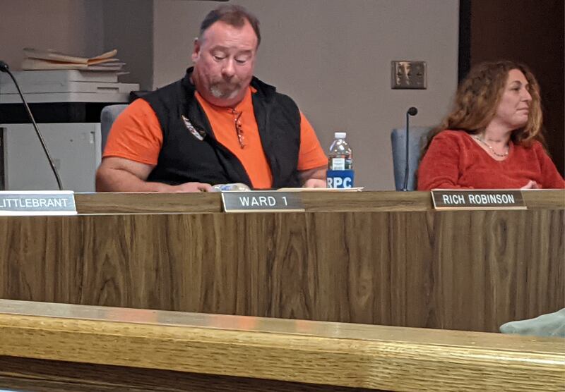 Sandwich First Ward Alderman Rich Robinson, left, and Second Ward Alderman Rebecca Johnson, right, discuss the issue of whether Sandwich should become a non-sanctuary city.