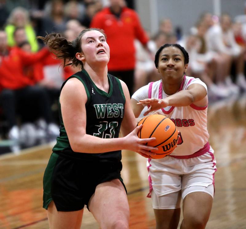Glenbard West's Makenna Yeager goes up for a shot during the Class 4A St. Charles East Sectional final against Batavia on Thursday, Feb. 27, 2025 in St. Charles.