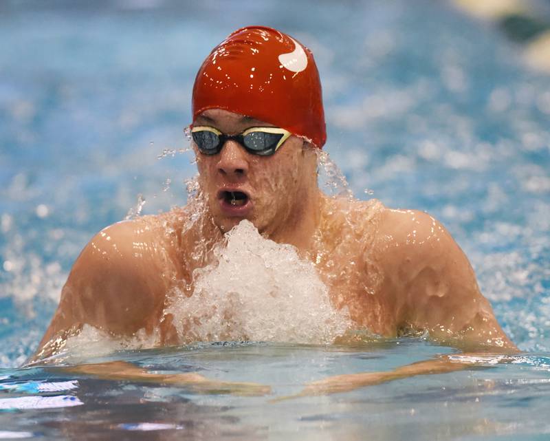 Hinsdale Central's Josh Bey swims the breaststroke leg of the 200-yard individual medley during the New Trier boys swimming invite in Winnetka Saturday.