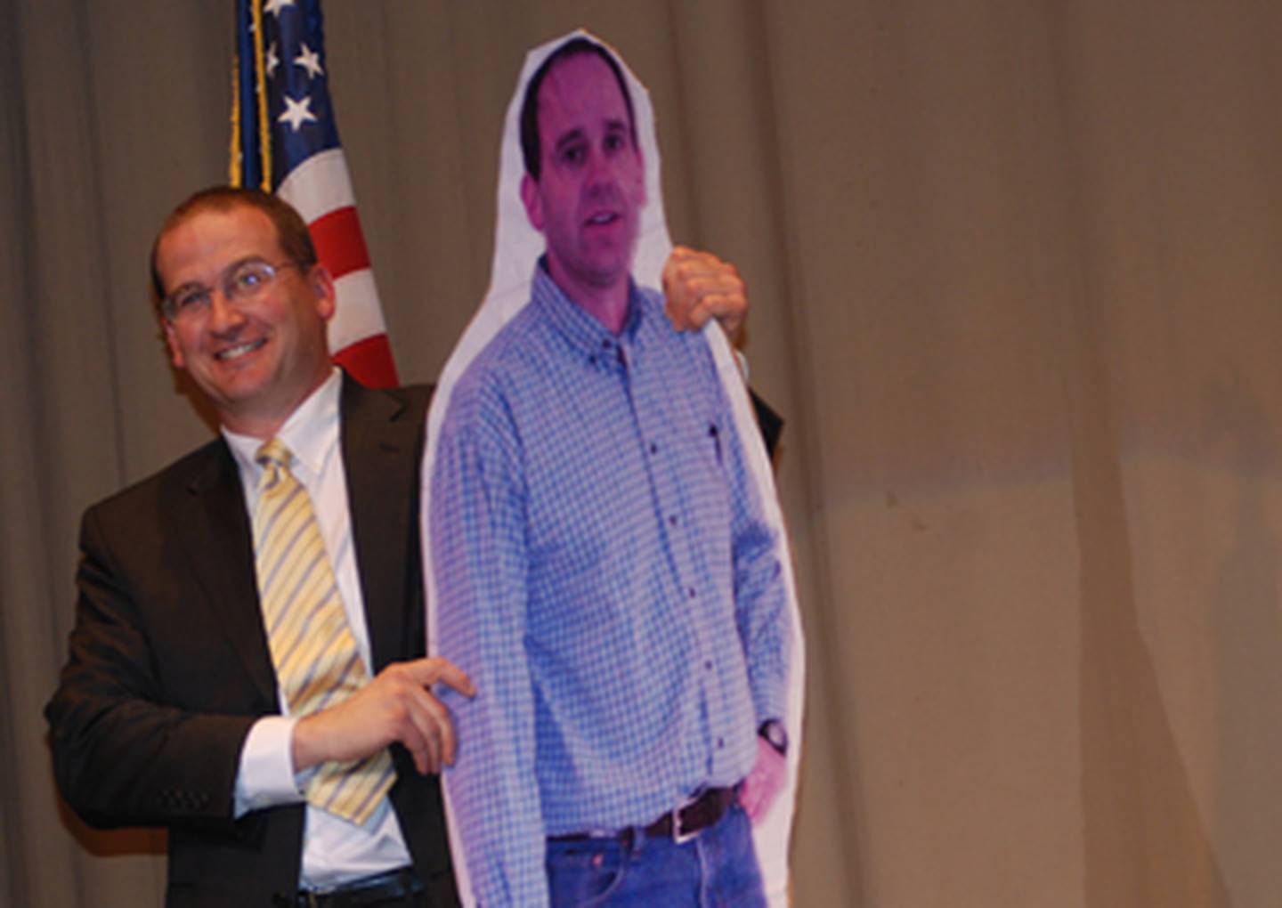 Jeff Maierhofer stands with the life-size cutout of fellow FFA advisor and Seneca Township High School ag teach Kent Weber he received during the FFA Banquet Saturday. Weber received a similar likeness of Maierhofer from FFA members at the annual event.