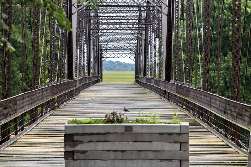 The historic Lyndon bridge is seen Thursday, July 30, 2025, spanning the Rock River. Closed in 1980, the village continues to sell plank repairs for a $100 donation with a name plate being dedicated to the donor.