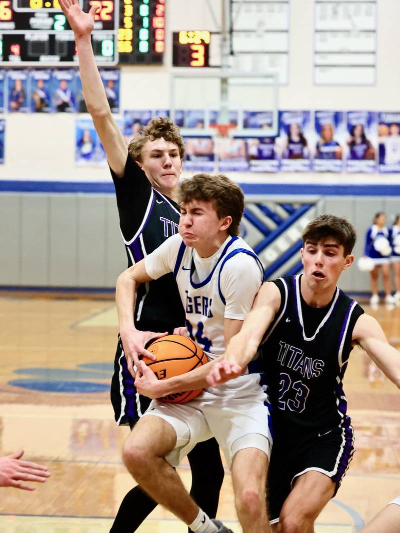 Princeton's Jackson Mason battles El Paso-Gridley's Owen Bergquist Tuesday night at Prouty Gym. The Titans defeated the Tigers 75-59.