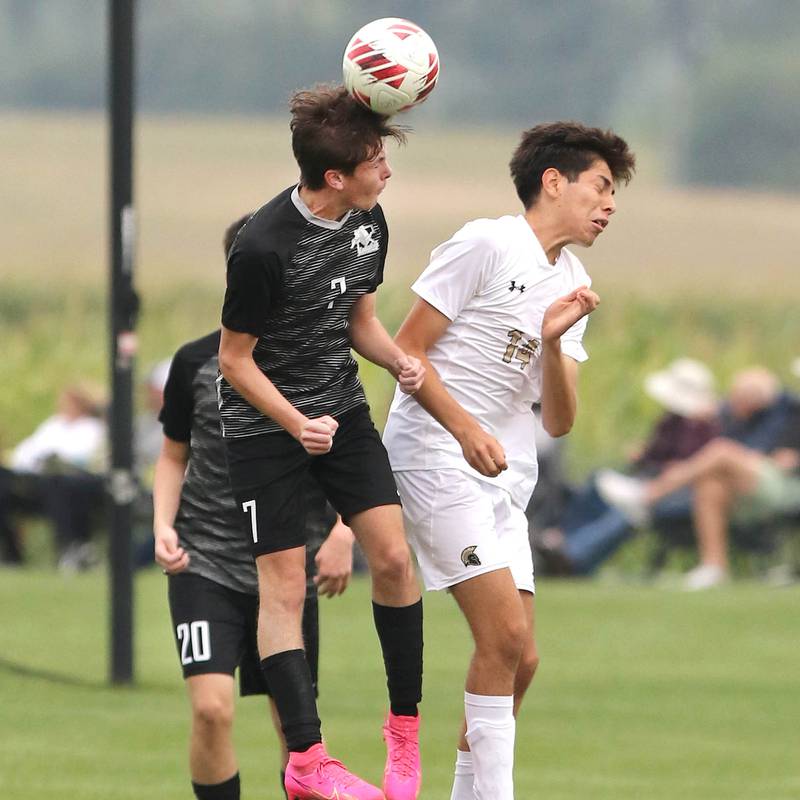 Kaneland's Cameron Guernon (left) and Sycamore's Javier Lopez go up for a header during their game Wednesday, Sept. 6, 2023, at Kaneland High School in Maple Park.