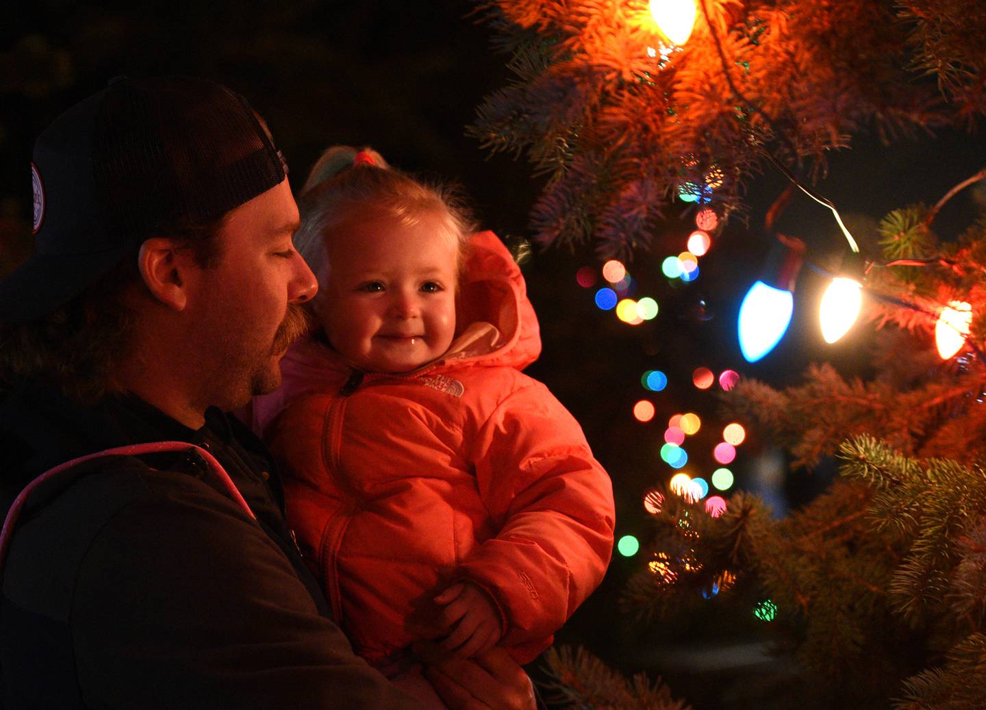 Michael Smith and daughter Elizabeth, 2, check out the lights up close after Batavia’s holiday tree lighting Sunday, Nov. 27, 2022.