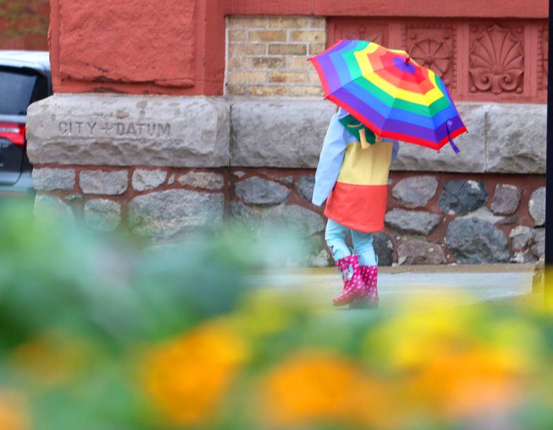 Kalani Nickolas, 4, of Woodstock, strolls during the farmers market Saturday, April 29, 2023, on the historic Woodstock Square.