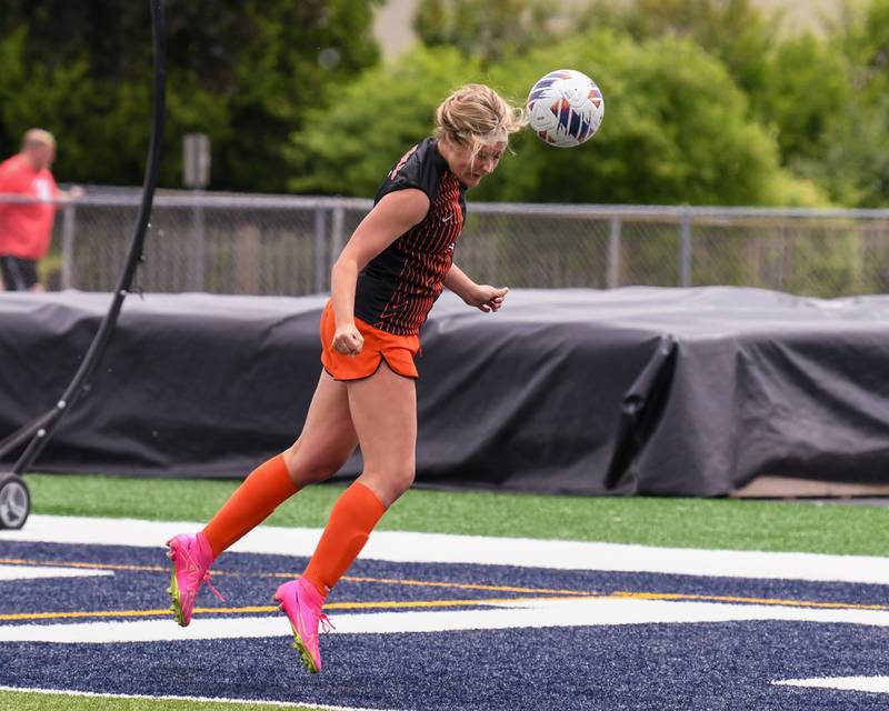 St. Charles North Noreen Grier (6) heads the ball during the first half of the sectional title game on Saturday May 27th while taking on St. Charles North held at West Chicago Community High School.