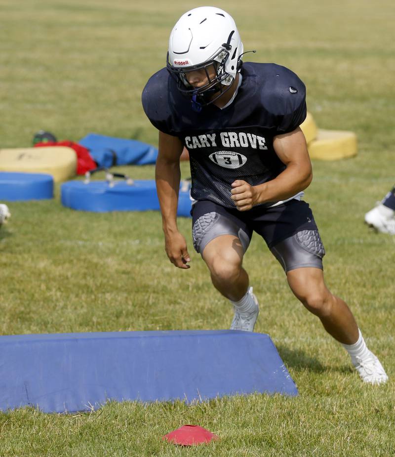 Cary-Grove’s Holden Boone runs a drill during football practice Thursday, June 29, 2022, at Cary-Grove High School in Cary.