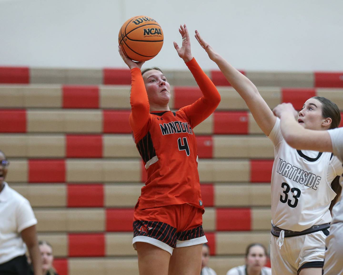 Minooka's McKenna Delaney (4) puts up a shot during their basketball game between Minooka at Plainfield North. Feb 06, 2025 in Plainfield.