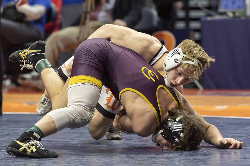 Montini’s Mikey Malizzio (bottom) and Washington’s Noah Woods compete in the 120 pound weight class of the 2A state individual wrestling finals Saturday, Feb. 22, 2025, at State Farm Center in Champaign.