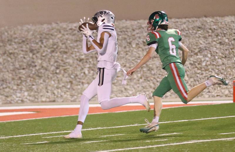 Kaneland's Brady Brown makes a catch over L-P's Joel Lightle to score a touchdown on Friday, Oct. 17, 2025 at Howard Fellows Stadium.