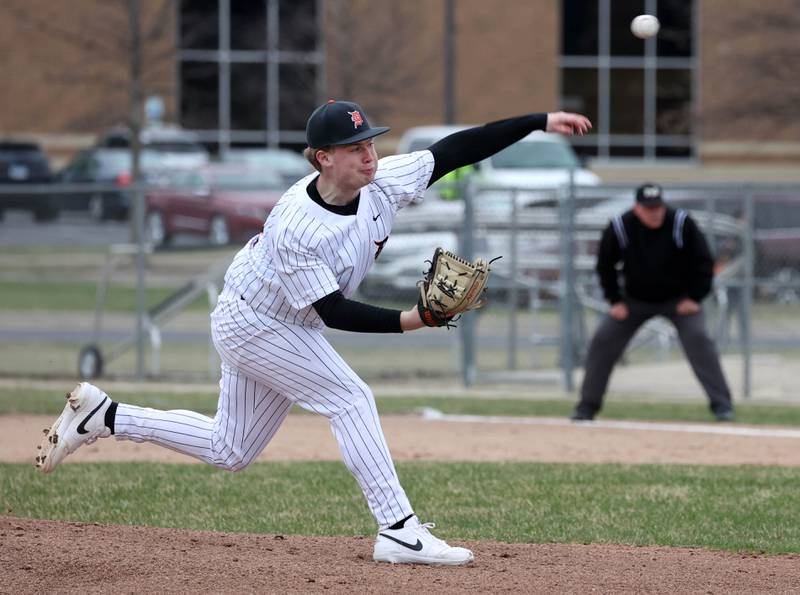 DeKalb's Aidan Lange delivers a pitch during their game against Harlem Tuesday, April 1, 2025, at DeKalb High School.