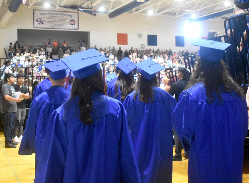 Seniors enter the gymnasium during graduation Saturday, May 20, 2023, at Genoa-Kingston High School.