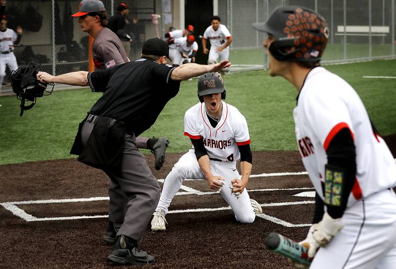 McHenry’s Carver Cohn celebrates scoring  the game winning run during a Fox Valley Conference baseball game against Crystal Lake Central  on Friday, May 2, 2025, at McHenry High School.