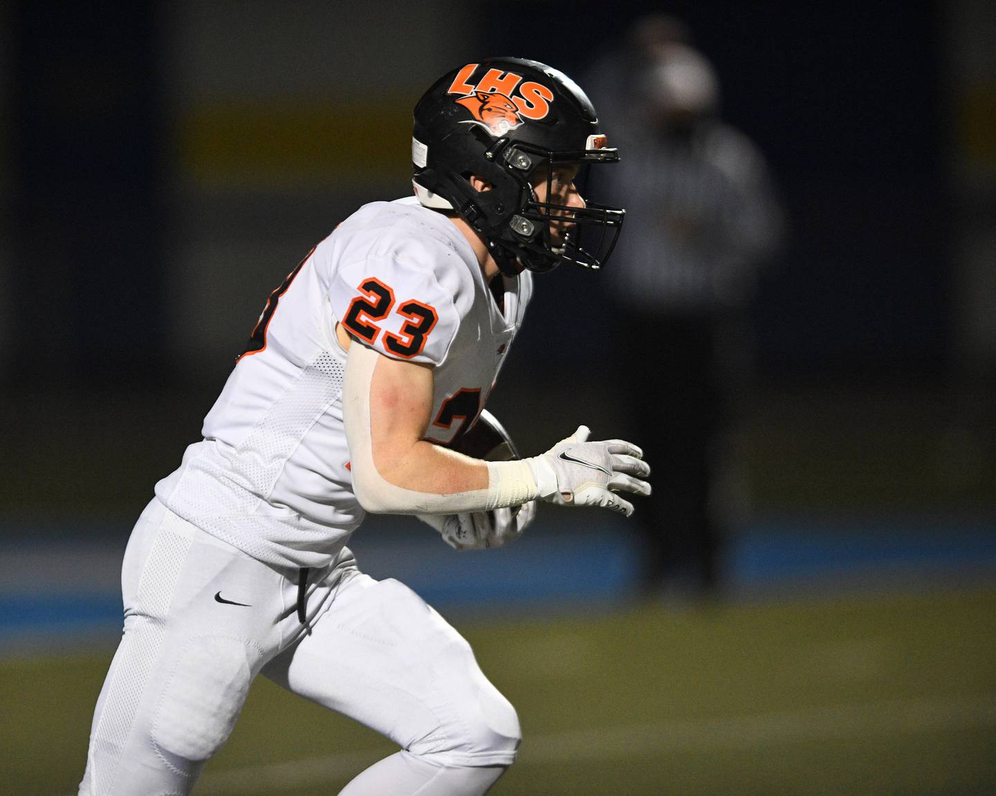 Libertyville's Tommy Latka runs against Warren in a football game in Gurnee Friday, April 23, 2021. He scored two plays later.