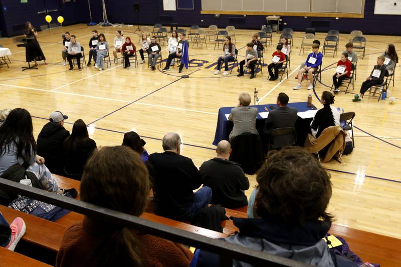 The 21 contestants fill the gym floor at the start of the McHenry County Regional Office of Education’s 2025 Spelling Bee on Wednesday, March 19, 2025, at Bernotas Middle School in Crystal Lake.
