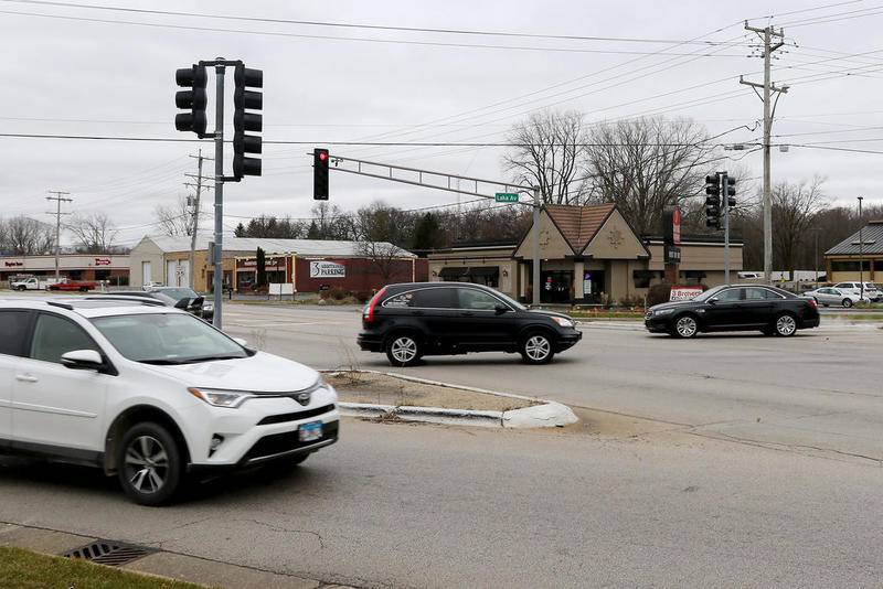 Vehicles travel to their destinations by way of the intersection of Lake Avenue and Route 47 on Monday, Nov. 30, 2020, in Woodstock. The intersection will become a roundabout as part of the Route 47 widening project.