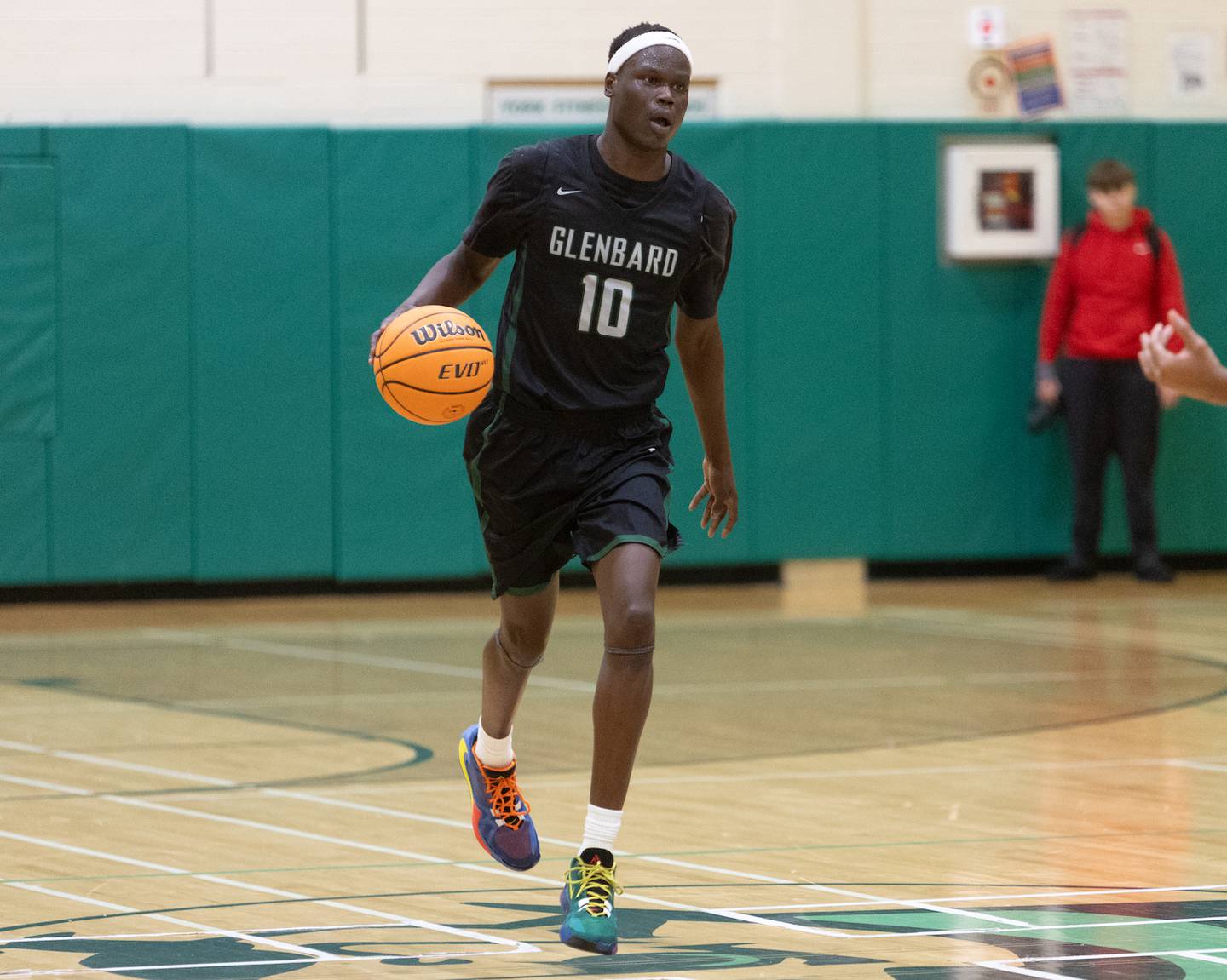 Glenbard West's Josh Abushanab calls a play against Yorkville on Friday Dec. 26,2025 at the 51st. Annual Jack Tosh Holiday Tournament in Elmhurst.