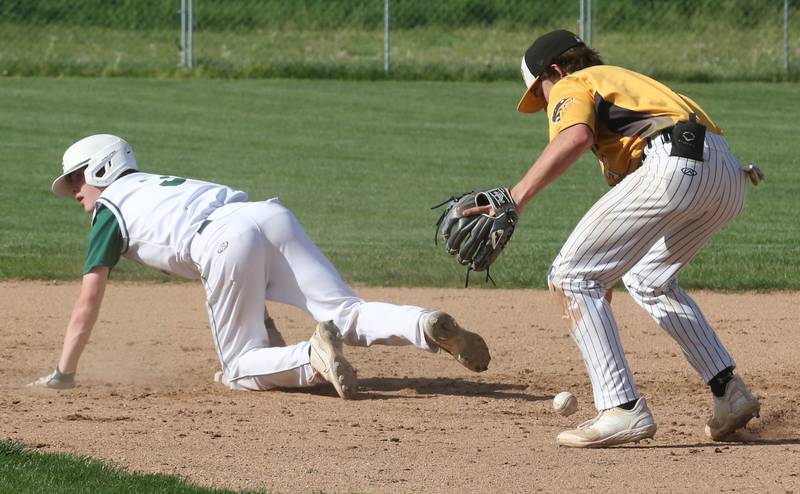 St. Bede's Carson Riva slides safe into second base as Putnam County's Johnathon Stunkel bobbles the ball on Tuesday, April 30, 2024 at St. Bede Academy.