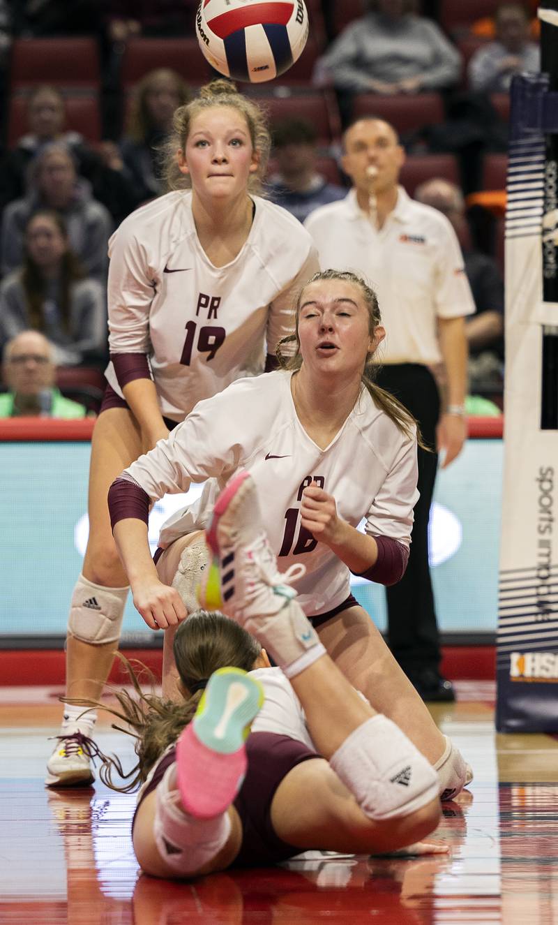 Prairie Ridge's Tegan Vrbancic (back) and Adeline Grider eye the ball against DePaul College Prep Saturday, Nov. 16, 2024, in the Class 3A third place state volleyball match at CEFCU Arena in Normal.