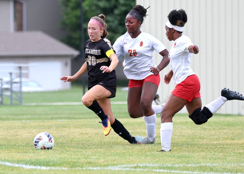 Sycamore's Cortni Kruizenga pushes the ball ahead of two Rock Island defenders Friday, May 22, 2026, during their Class 2A regional championship matchup at Sycamore High School.