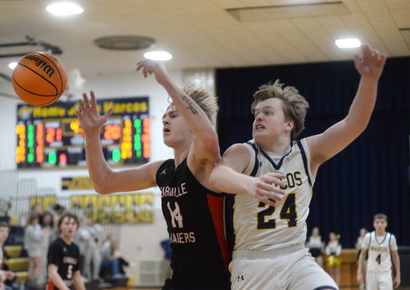 Earlville's Adam Waite (14) and Polo's Aiden Messer (24) battle for a rebound during a Monday, Feb. 10, 2025 game at Polo High School.