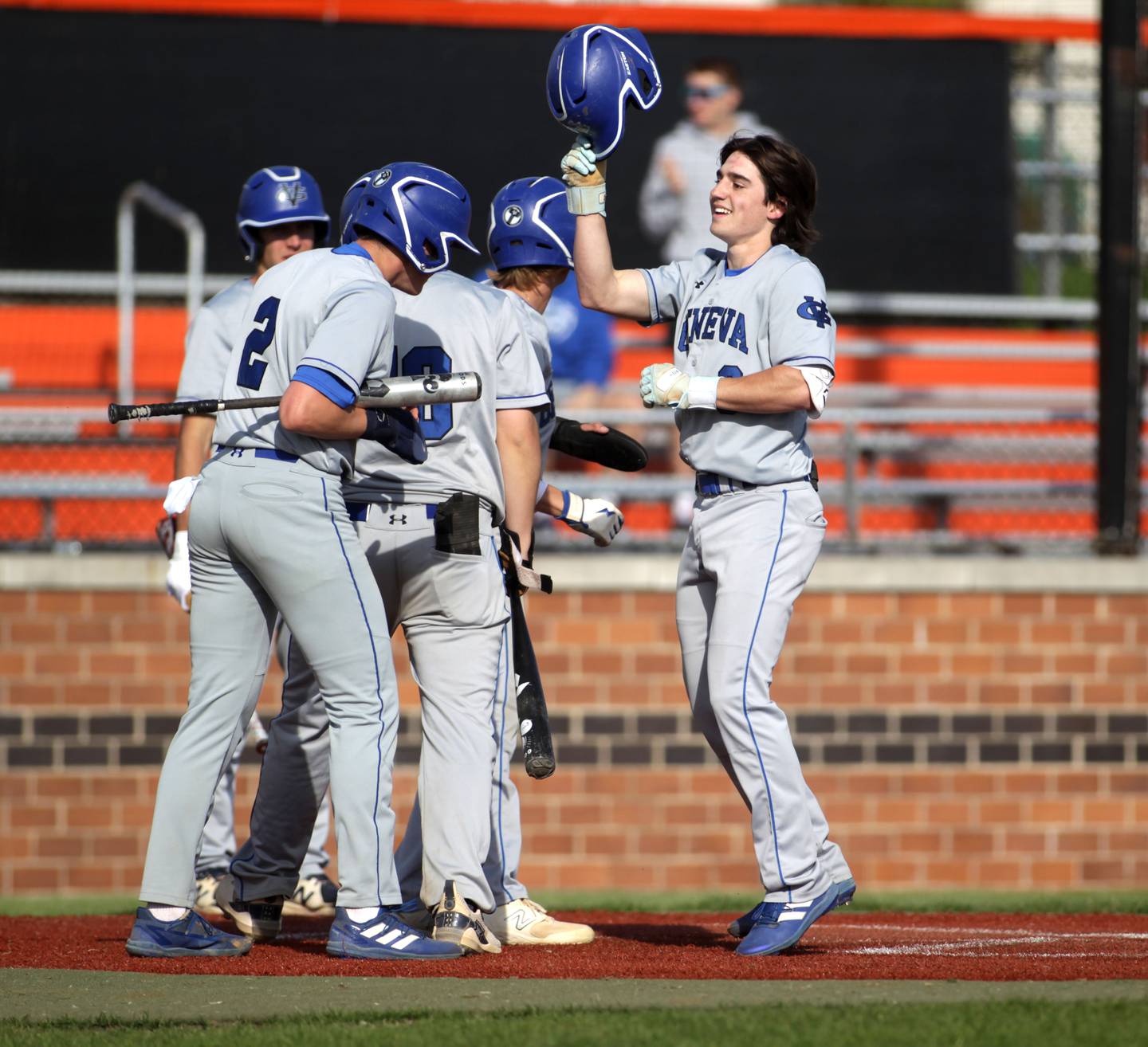 Geneva’s Nate Stempowski (right) celebrates a 3-run home run during a game at St. Charles East on Friday, April 28, 2023. East won 7-6.