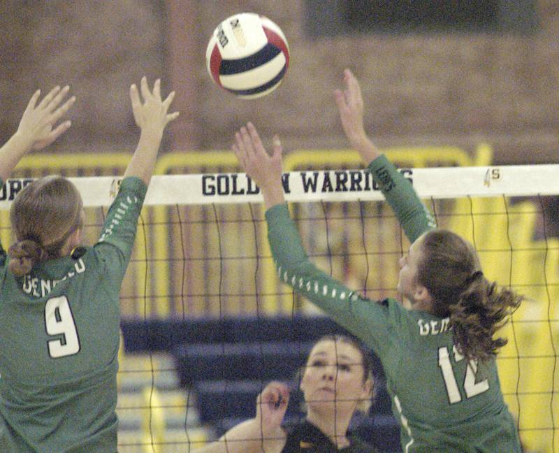 Sterling's Natilie Eddinger watches as a ball is blocked by two Geneseo defenders. The action took place at the Sterling vs. Geneseo Volleyball match at Homer Musgrove fieldhouse, on Thursday, Sept. 5, 2024