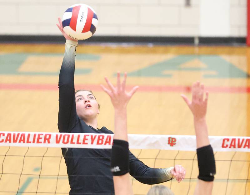 Sycamore's Norah Chami spikes the ball to Washington during the Class 3A Sectional semifinal game on Tuesday, Nov. 4, 2025 in Sellett Gymnasium at L-P High School.