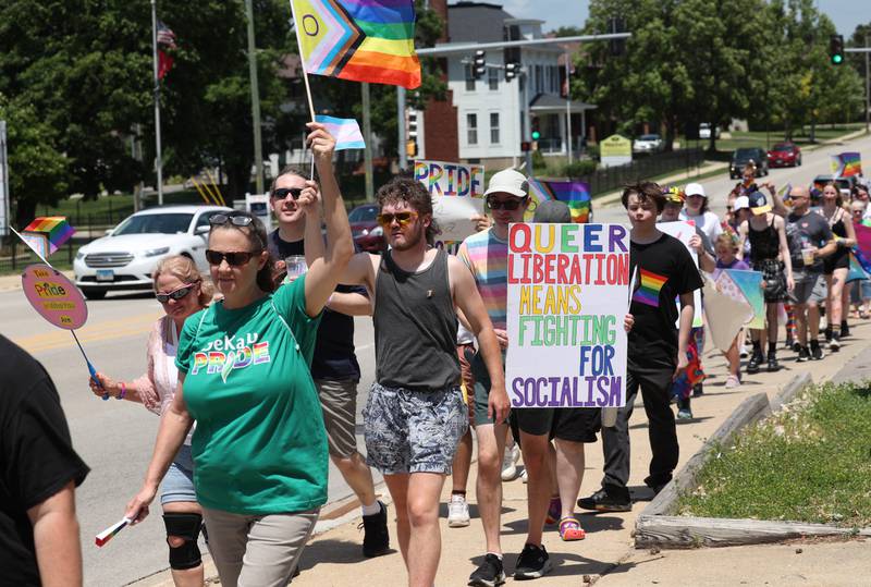 Parade marchers head south on First Street approaching Lincoln Highway Saturday, June 21, 2025, during the DeKalb Pride Fest in downtown DeKalb.