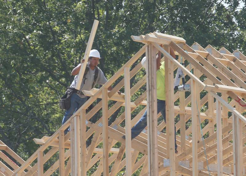 Workers build a new cabin unit on Monday, Aug. 28, 2023 at Grand Bear Resort at Starved Rock in Utica.