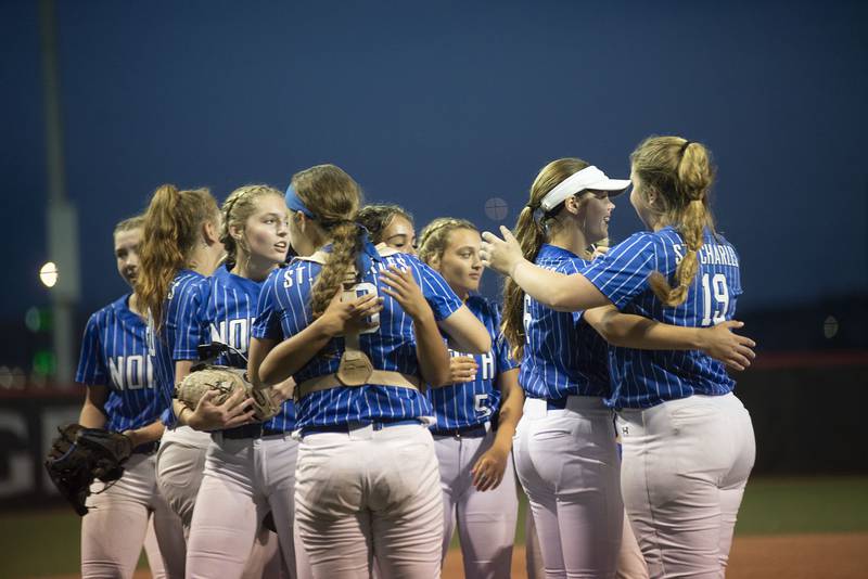 St Charles North celebrate their 2-0 win over Edwardsville Friday, June 10, 2022 in the class 4A IHSA state softball semifinal game.