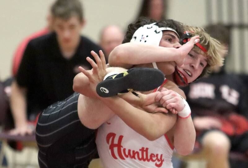 Huntley’s Julian Gutierrez battles Crystal Lake Central’s Dylan Ramsey at 126 pounds in varsity wrestling on Friday, Dec. 13, 2024 at Huntley High School in Huntley.