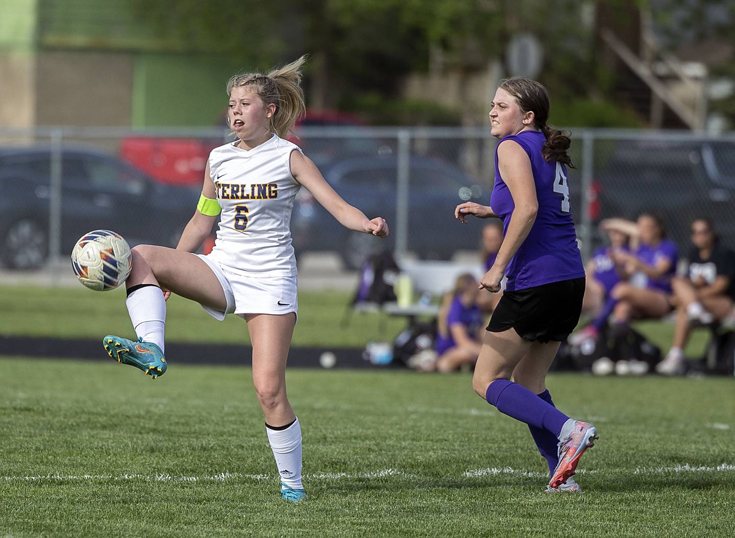 Sterling’s Lainey Block controls the ball against Dixon’s Carlie Cook Tuesday, May 9, 2023.