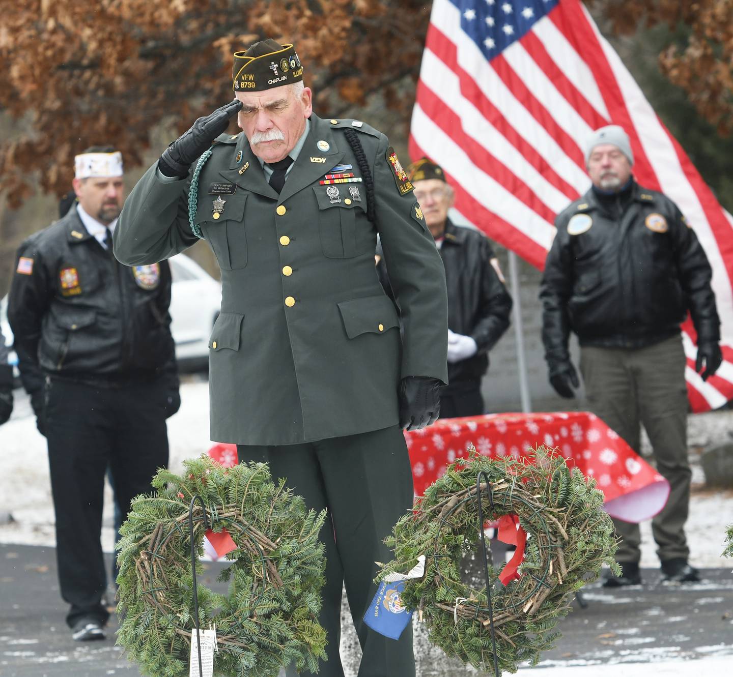 John Tuttle of Oregon, a Vietnam war veteran, salutes after laying a wreath in honor Prisoners of War and those Missing in Action at Daysville Cemetery on Dec. 17 during the Wreaths Across America project. Wreaths were then placed on all veterans' graves by other volunteers and veterans.