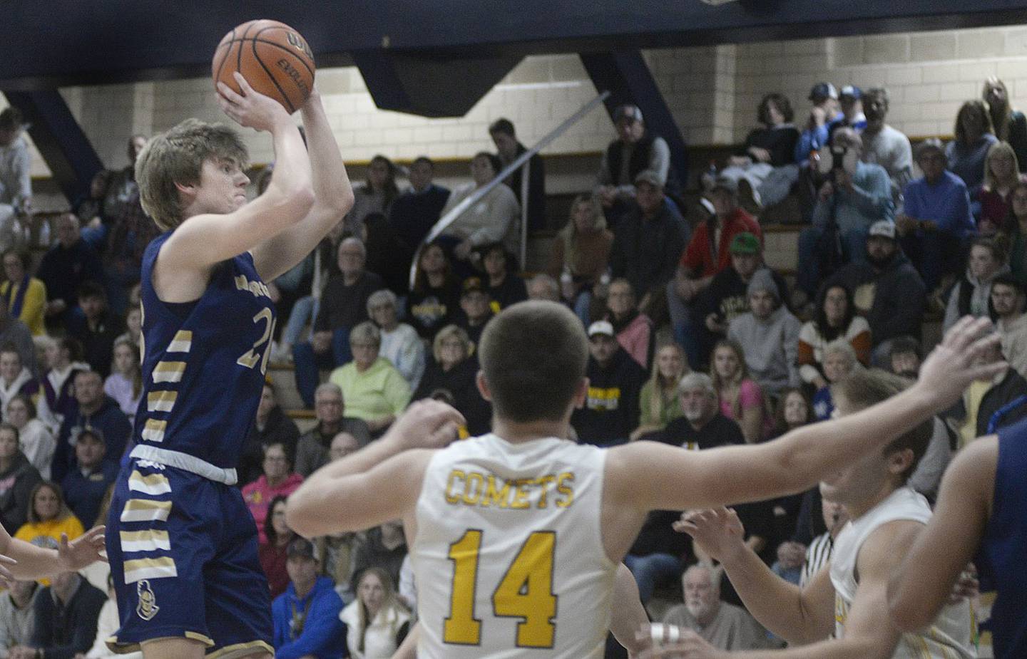 Marquette’s Logan Nelson shoots for two over the Reed-Custer defense in the first quarter of Wednesday's semifinal of the Marquette Christmas Tournament at Bader Gym in Ottawa. - 12/28/22
