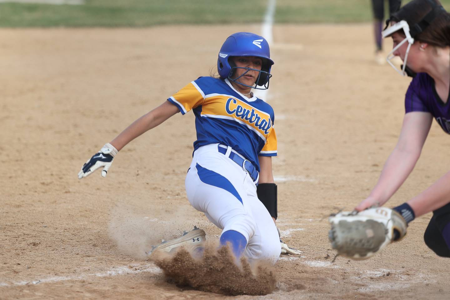 Joliet Central’s Nevey Ibarra scores ahead of the tag Wilmington’s Rylee Lehnert on Tuesday, March 12 in Joliet.