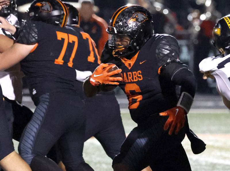 DeKalb's Travis Moore carries the ball during their game against Andrew  Friday, Oct. 16, 2025, at DeKalb High School.