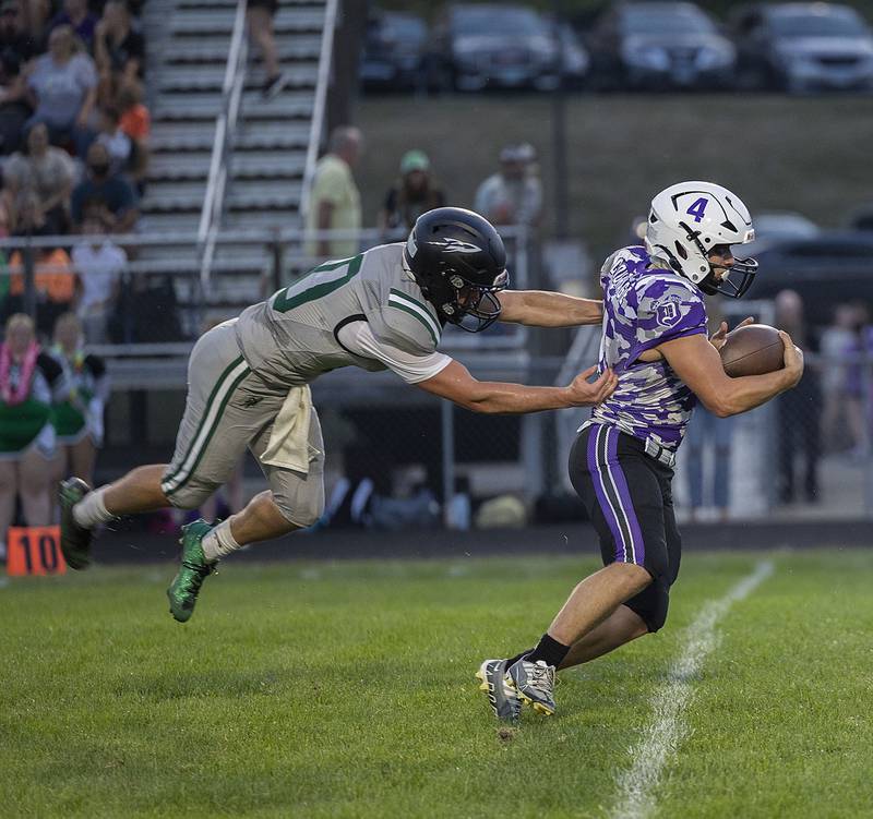 Rock Falls’ Trail Stonitsch misses a tackle on Dixon’s Landon Knigge Friday, Sept. 12, 2025, during Dixon’s home opener.