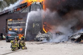 Crews battle Kane County barn fire with heavy smoke and roof collapse