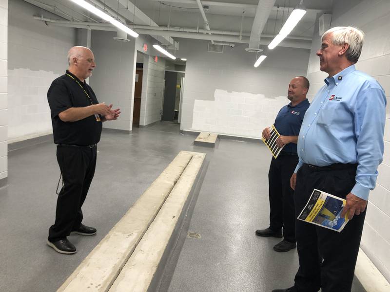 Harvard High School Athletic Directory Barry Barry Gurvey, left, discusses the locker rooms and supply chain delays with Jay Schaack and Ian Lamp of Lamp Construction, Inc., on Aug. 9, 2022. The lockers are expected on Sept. 4, 2022.