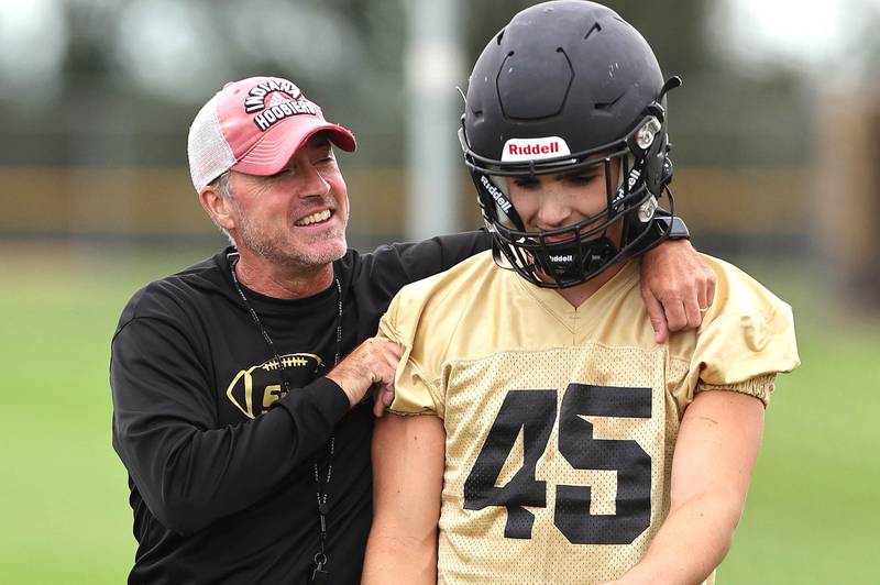 Sycamore head coach Joe Ryan talks to Kaden Ladas Monday, Aug. 8, 2022, at the school during their first practice ahead of the upcoming season.