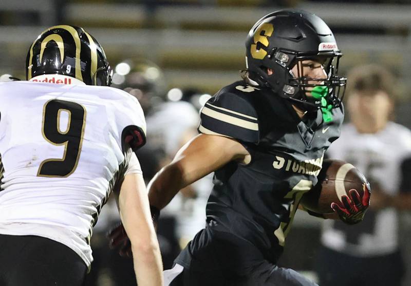 Sycamore's Kayden Galto gets by Oak Forest's Jackson Castaneda for a nice gain on a punt return during their game Friday Sept. 2, 2022, at Sycamore High School.