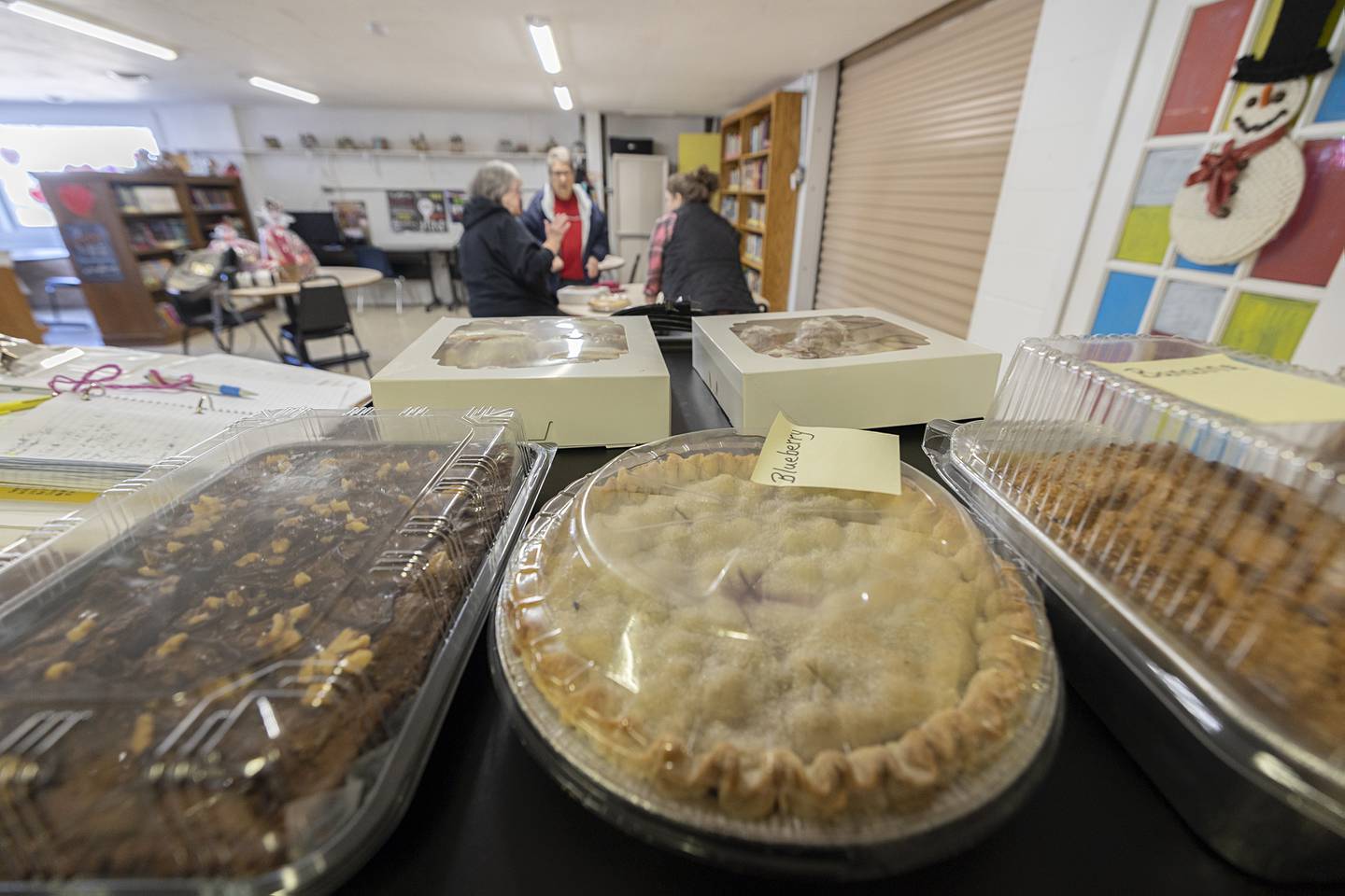 A selection of pies, brownies and rolls wait to be picked up Friday, Feb. 13, 2026, for the Amboy Teen Turf bake sale. 38 items went up for sale to help fund the after school program.