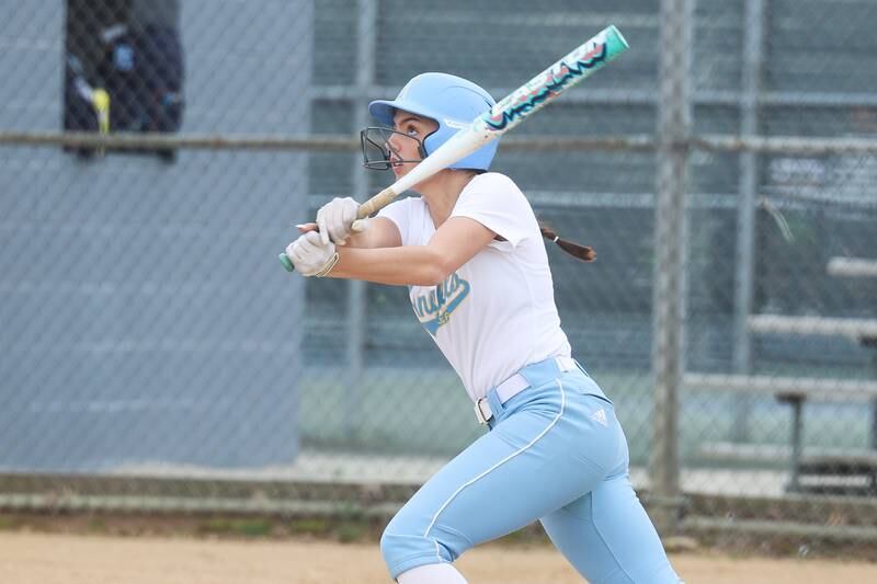 Joliet Catholic’s Addie Fanter eyes her shot clear the fence for a three run home run against Plainfield South on Wednesday, April 10, 2024.