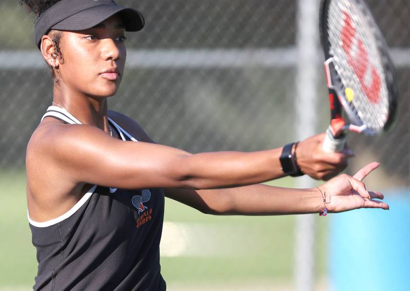 DeKalb's Ilanie Castorena follows through on a shot during her doubles match against Sycamore Monday, September 19, 2022, at Sycamore High School.