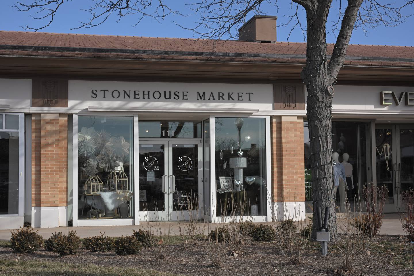 Fran Rouse poses in her Stonehouse Market business at 111 Town Square in Wheaton. She is opening another store in downtown Wheaton.