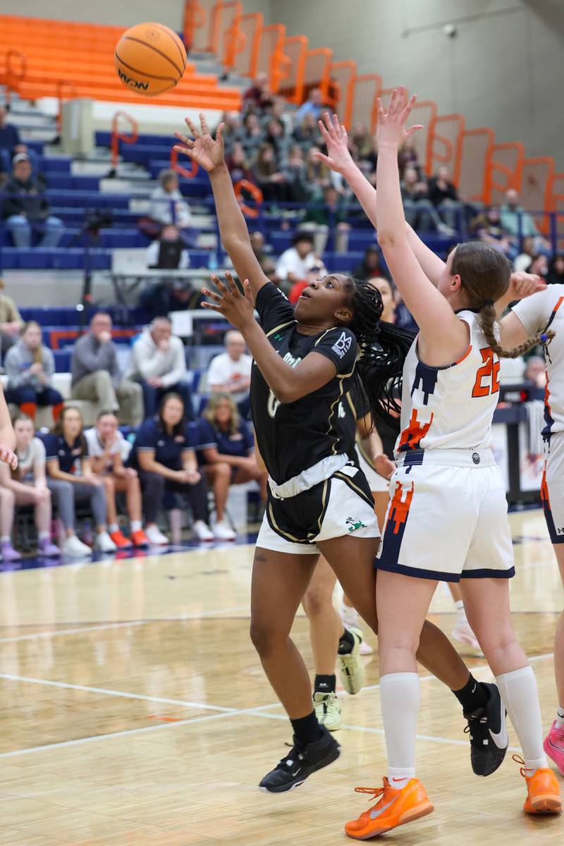 Bishop McNamara’s Mahlyia Johnson shoots the ball under pressure during the Fightin’ Irish’s 46-32 loss to Pontiac in the IHSA Class 2A Pontiac Sectional semifinal on Tuesday, Feb. 24, 2026, at Pontiac Township High School.