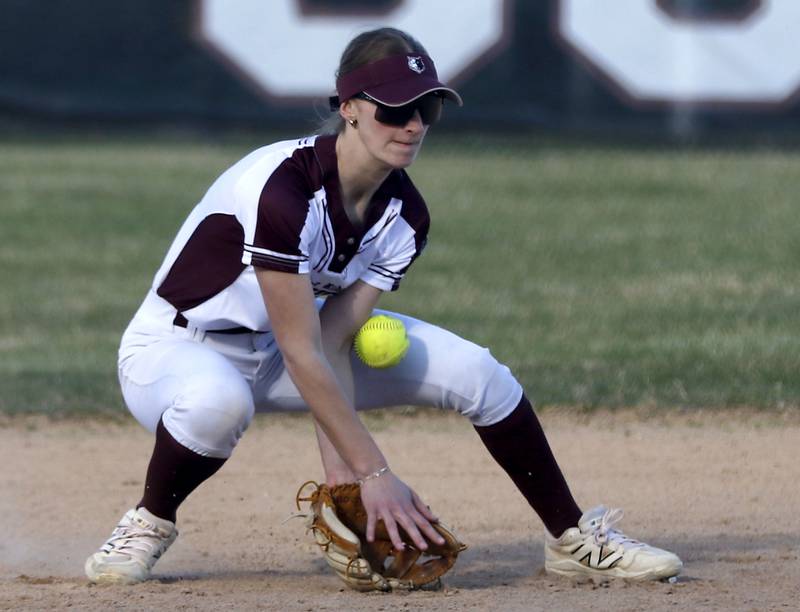Prairie Ridge\s Kylie Carroll tries to field the ball during a Fox Valley Conference softball game against Jacobs on April 8, 2026, at Prairie Ridge High School.