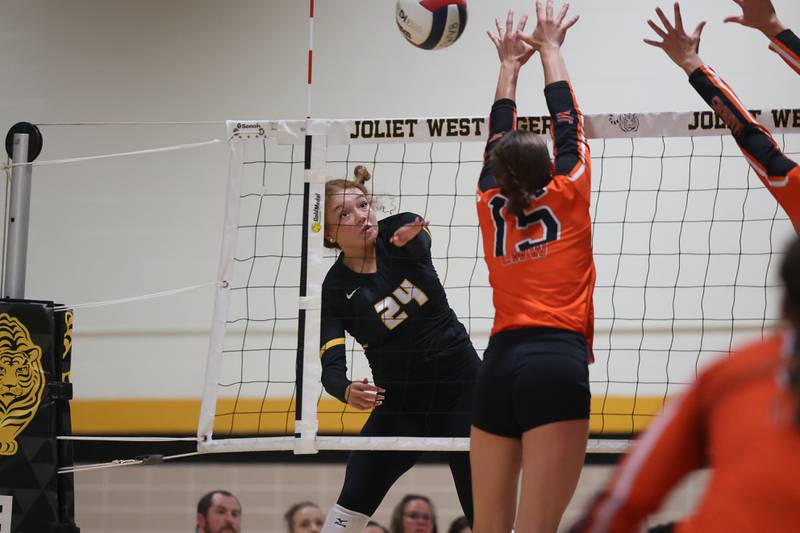 Joliet West’s Natalia Harris powers a shot against Lincoln-Way West on Tuesday, Sept. 12, in Joliet.